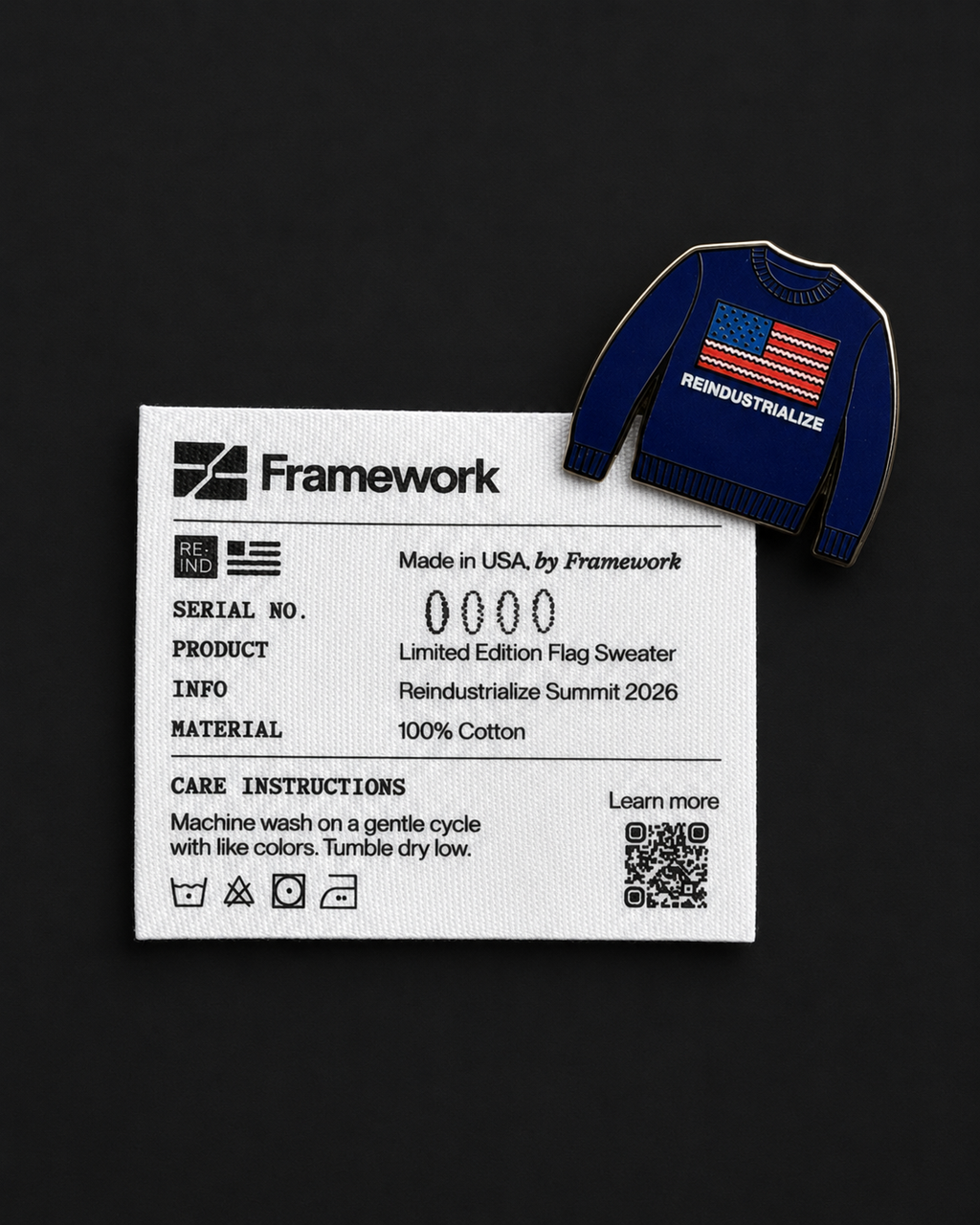 Blue sweater with American flag design on a black background, featuring Framework branding.